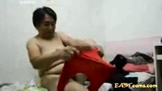 Asian Grandma get dressed after sex